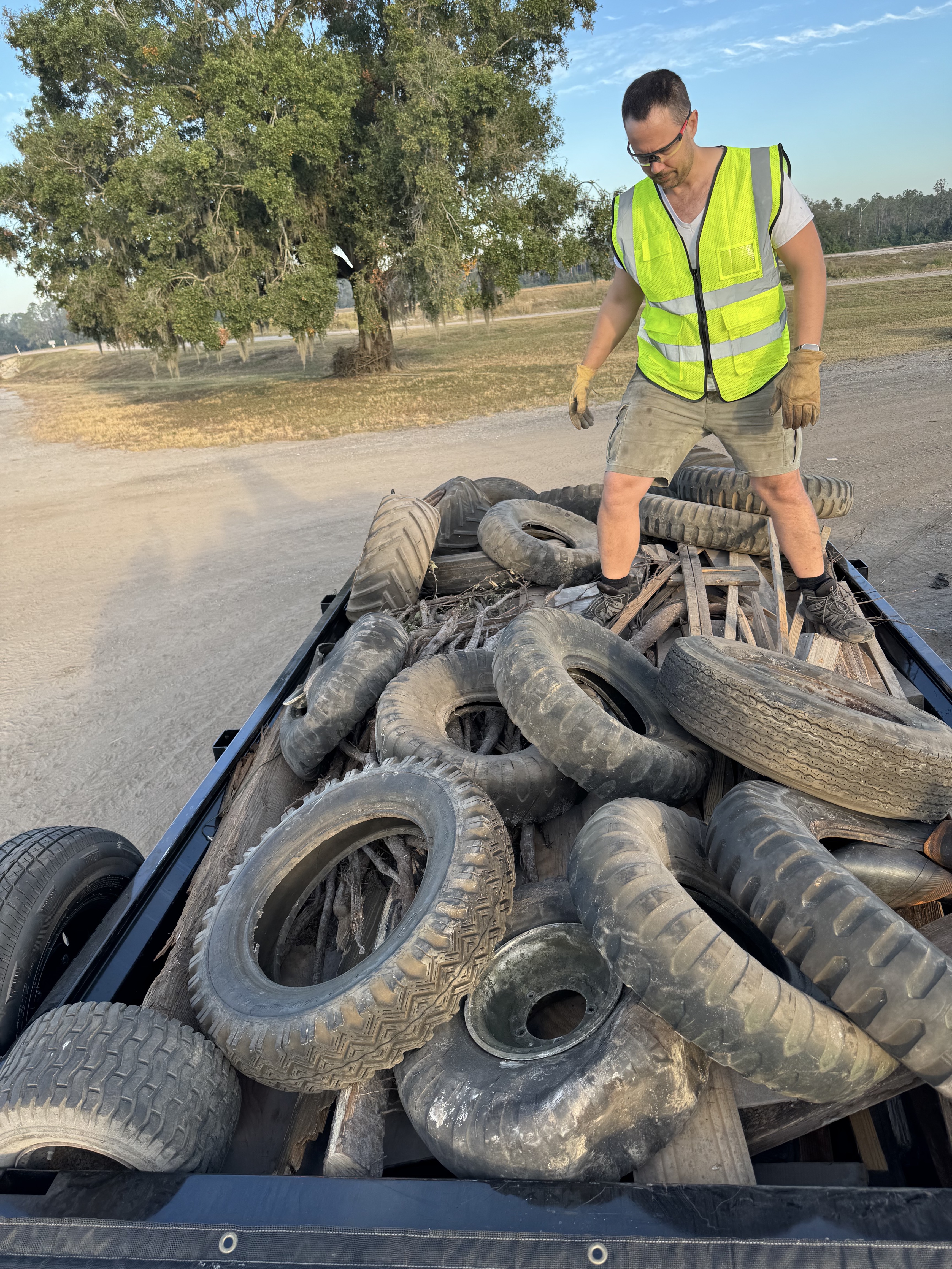 Trailer loaded with old tires and debris